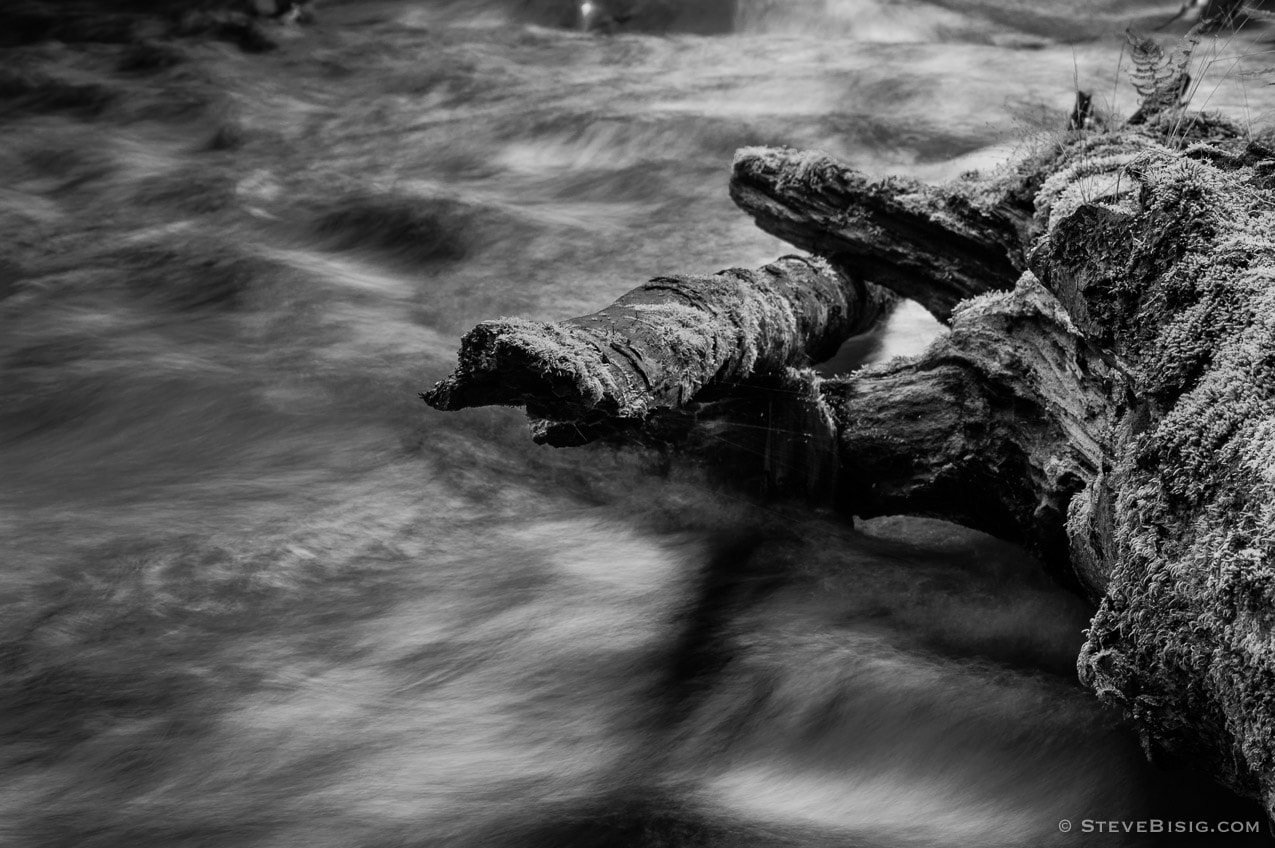 A black and white, long exposure photograph of the Lyre River on the Olympic Peninsula in Washington State.