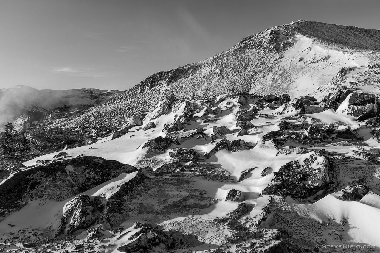 A black and white photograph of Burroughs Mountains after an early Autumn snow near Sunrise at Mount, Rainier National Park, Washington