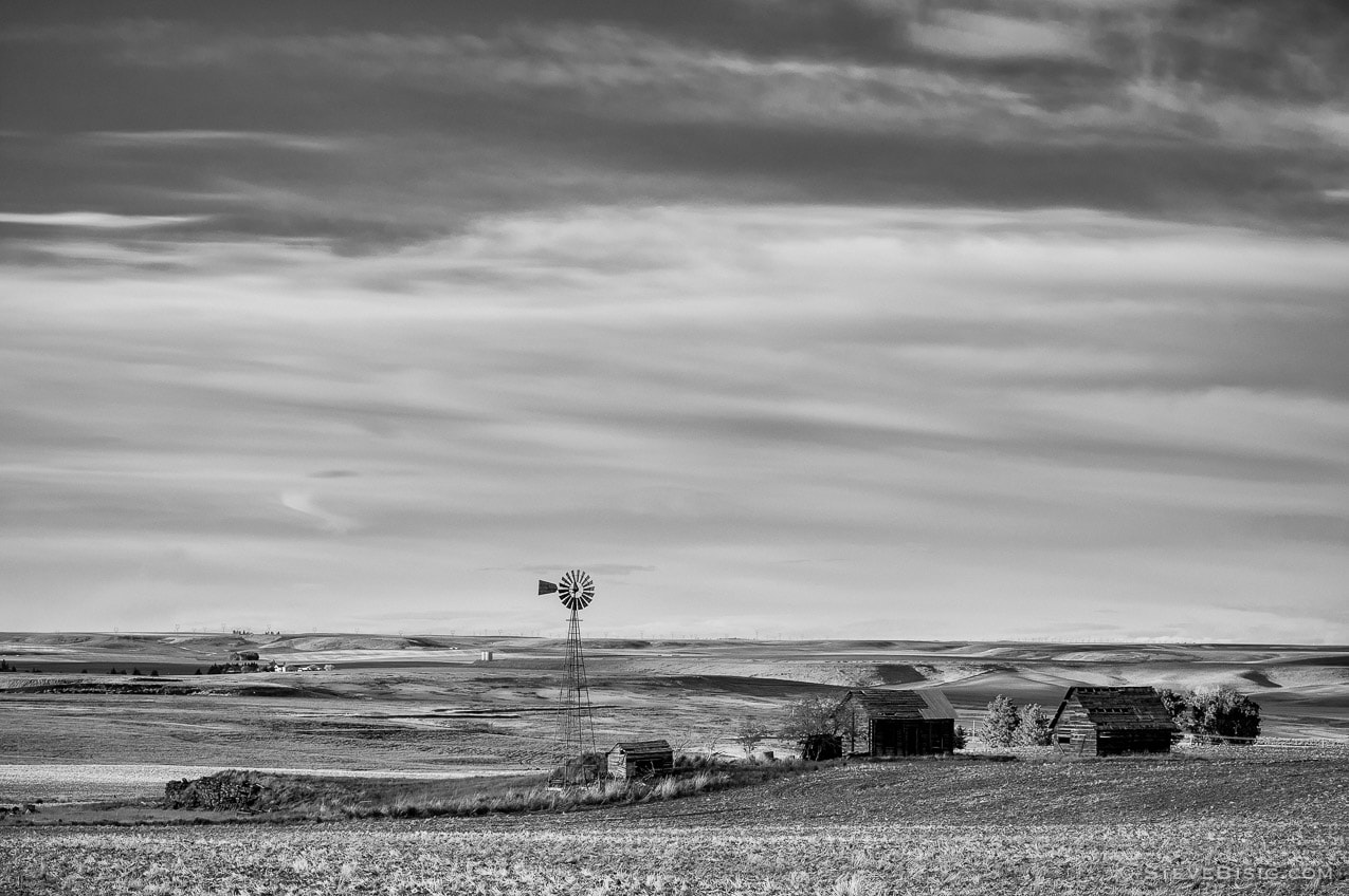 A black and white photograph of an old farm on Baseline Road in rural Douglas County near Waterville, Washington.