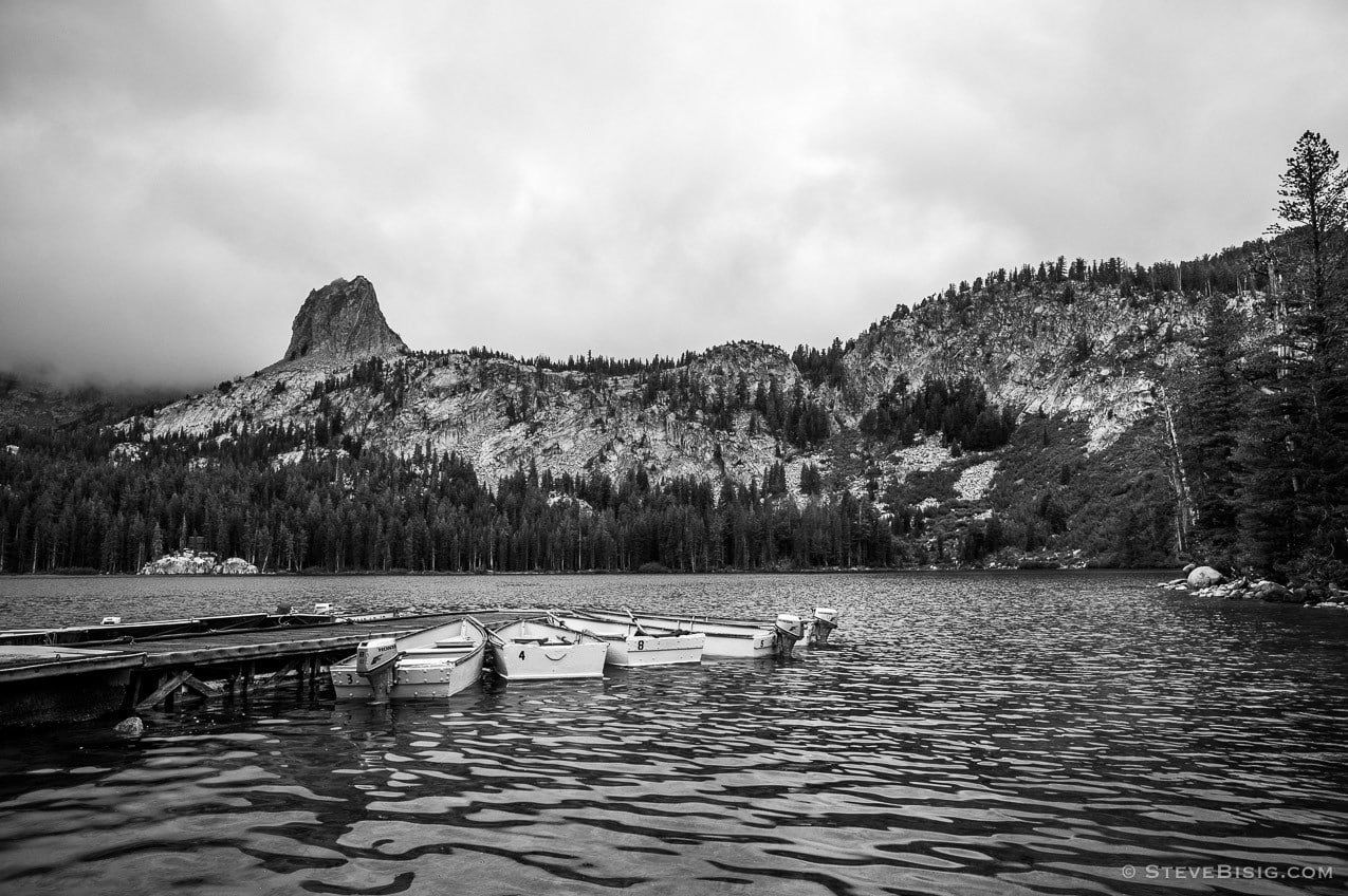 A black and white fine art photograph of the rental boats and marina at Lake George near Mammoth Lakes, California.