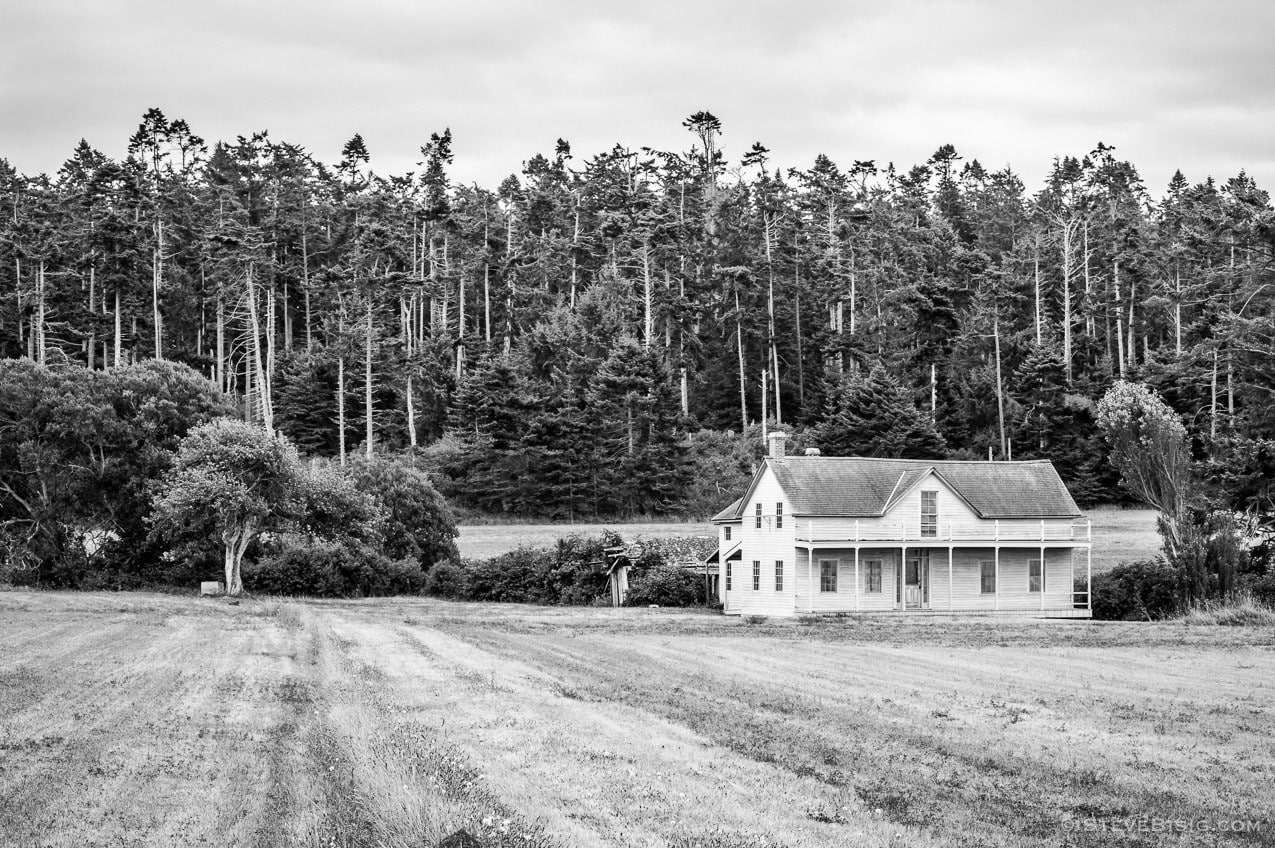 A black and white fine art photograph of the Ferry House on Whidbey Island near Coupeville, Washington.