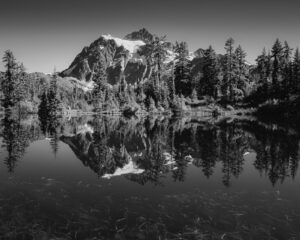 A fine art photograph of Mount Shuksan in the reflection of Picture Lake near Mount Baker Ski Area, Washington.