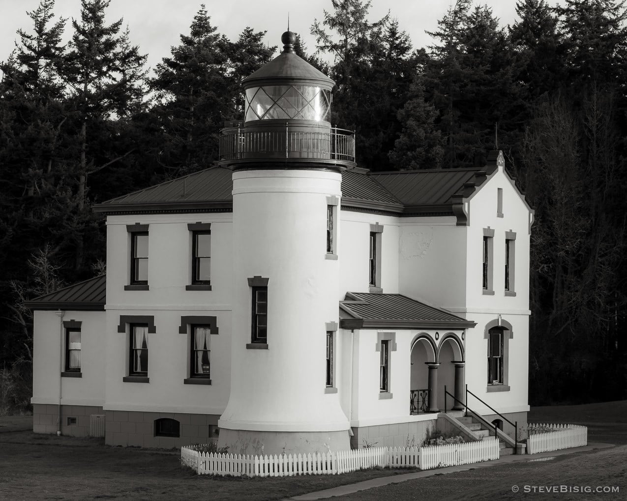 A black and white photograph of the Admiralty Head Lighthouse at Fort Casey State Park, Whidbey Island, Washington.