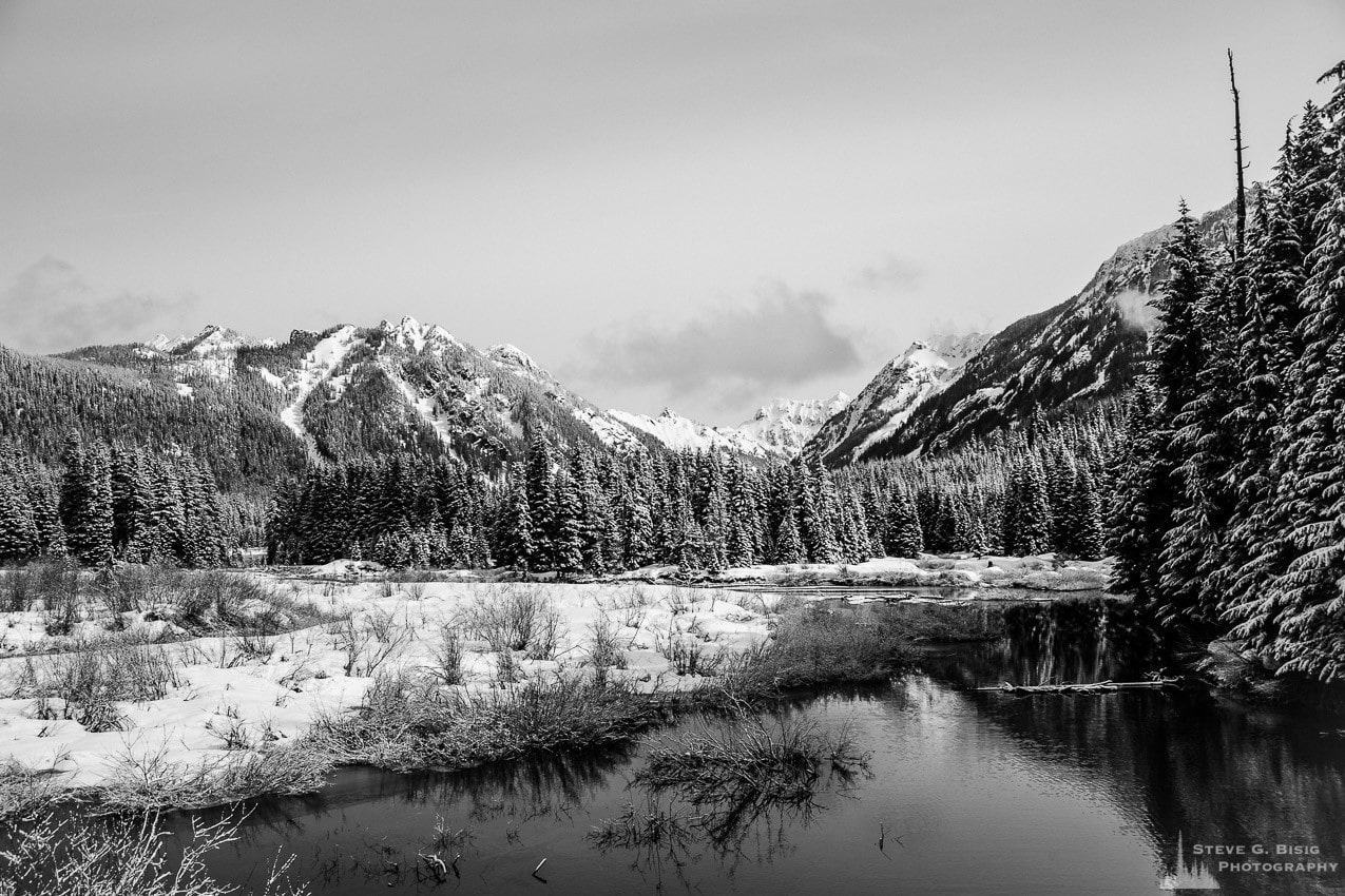 A black and white photograph of a snow covered Gold Creek Basin during early Spring from near Snoqualmie Pass, Washington.