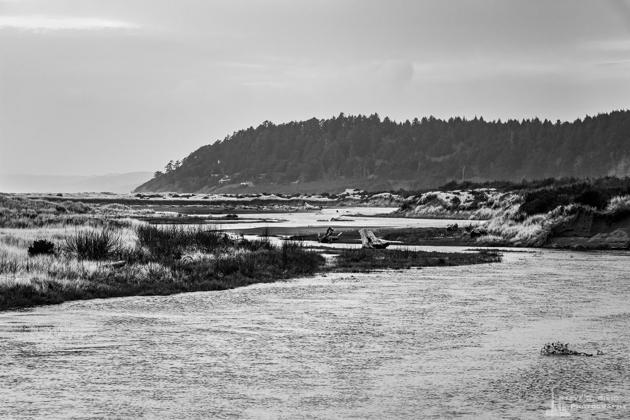 A black and white photograph of Conner Creek as it meanders through the sandy dunes at the Griffiths-Priday Ocean State Park before emptying in the Pacific Ocean along the Washington State coast.