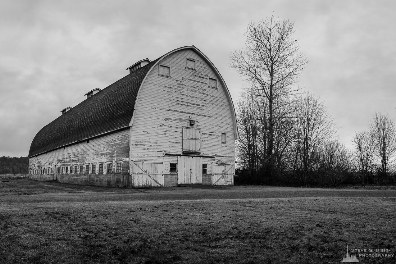 A black and white photograph of a historic barn at the Nisqually National Wildlife Refuge in Washington State.