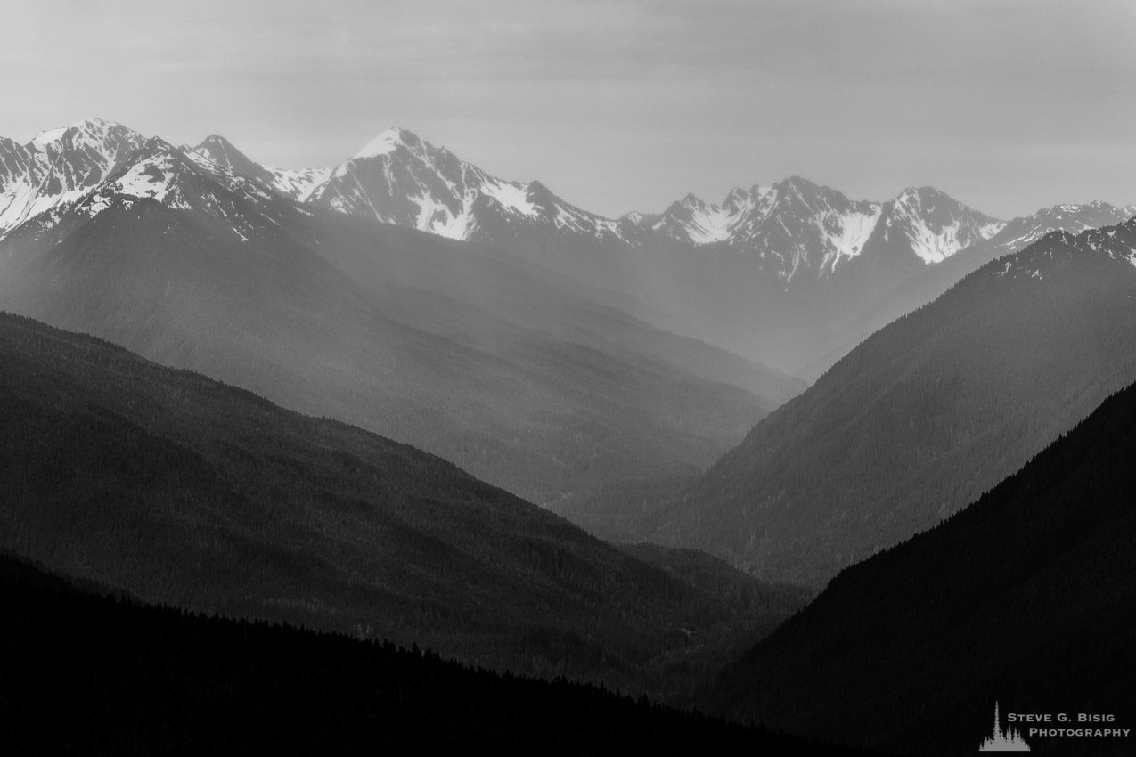 A black and white photograph of the Elwha River valley and the Olympic Mountains as viewed on a cloudy Spring day from Hurricane Ridge in the Olympic National Park, Washington.