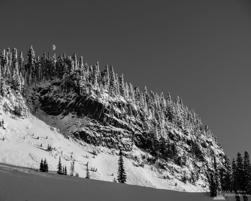 A black and white landscape photograph of a snow covered Inspiration Point at Mount Rainier National Park, Washington.
