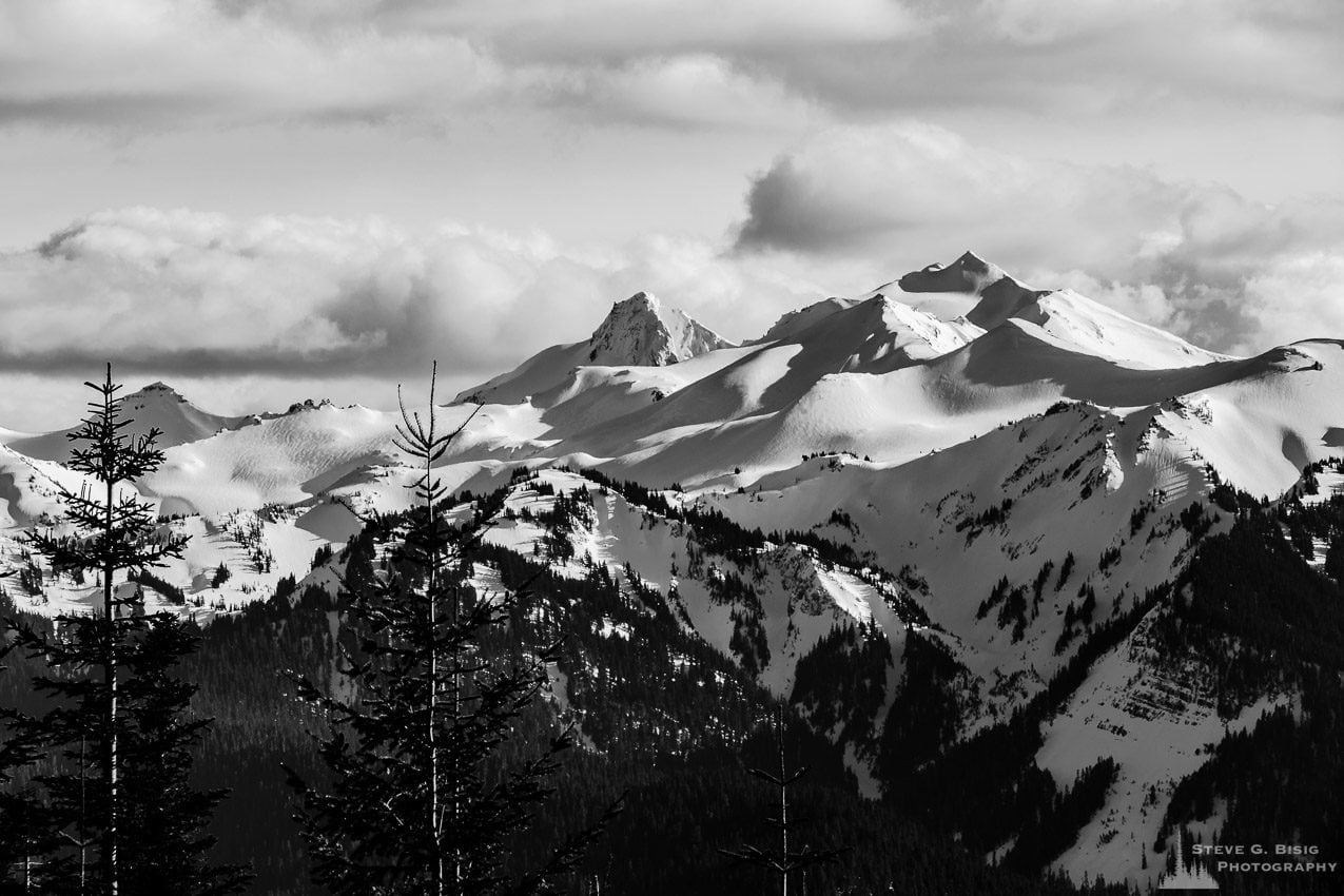 A black and white landscape photograph of Old Snowy Mountain and surrounding mountain peaks in the Goat Rocks Wilderness Area as viewed from Gifford Pinchot National Forest Road 1284 in Lewis County, Washington.