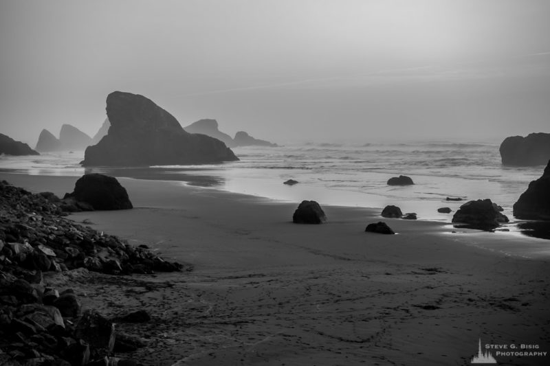 A black and white landscape photograph of the coast and seastacks at Myers Creek Beach along US101 near Gold Beach, Oregon.