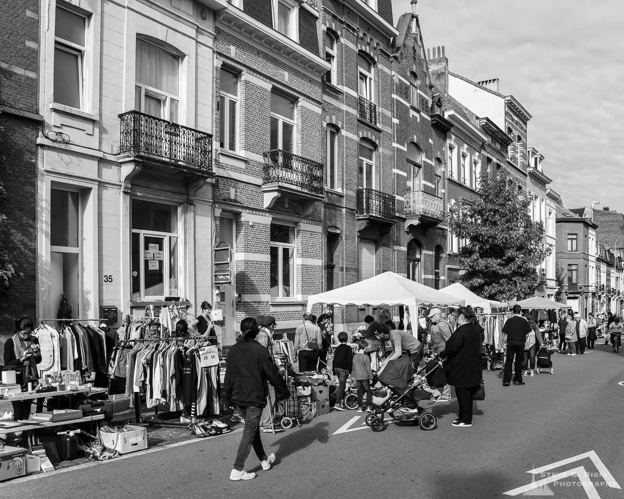 One of a series of black and white photographs from the 2018 Grande Braderie D'Ixelles sidewalk sale and street festival in Brussels, Belgium.