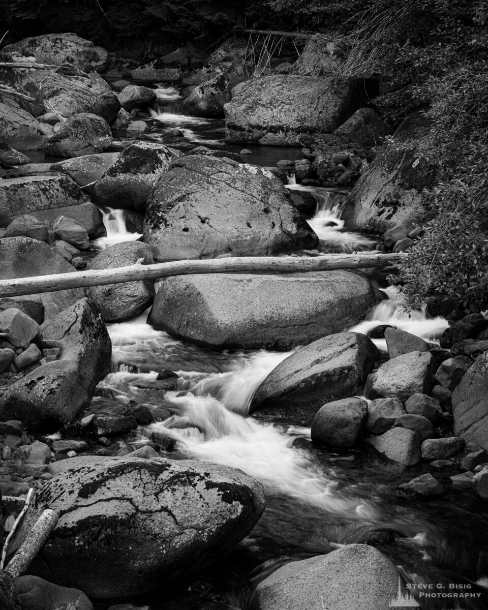 A black and white landscape photograph of the rocky creekbed of Table Creek in the Gifford Pinchot National Forest, Washington.
