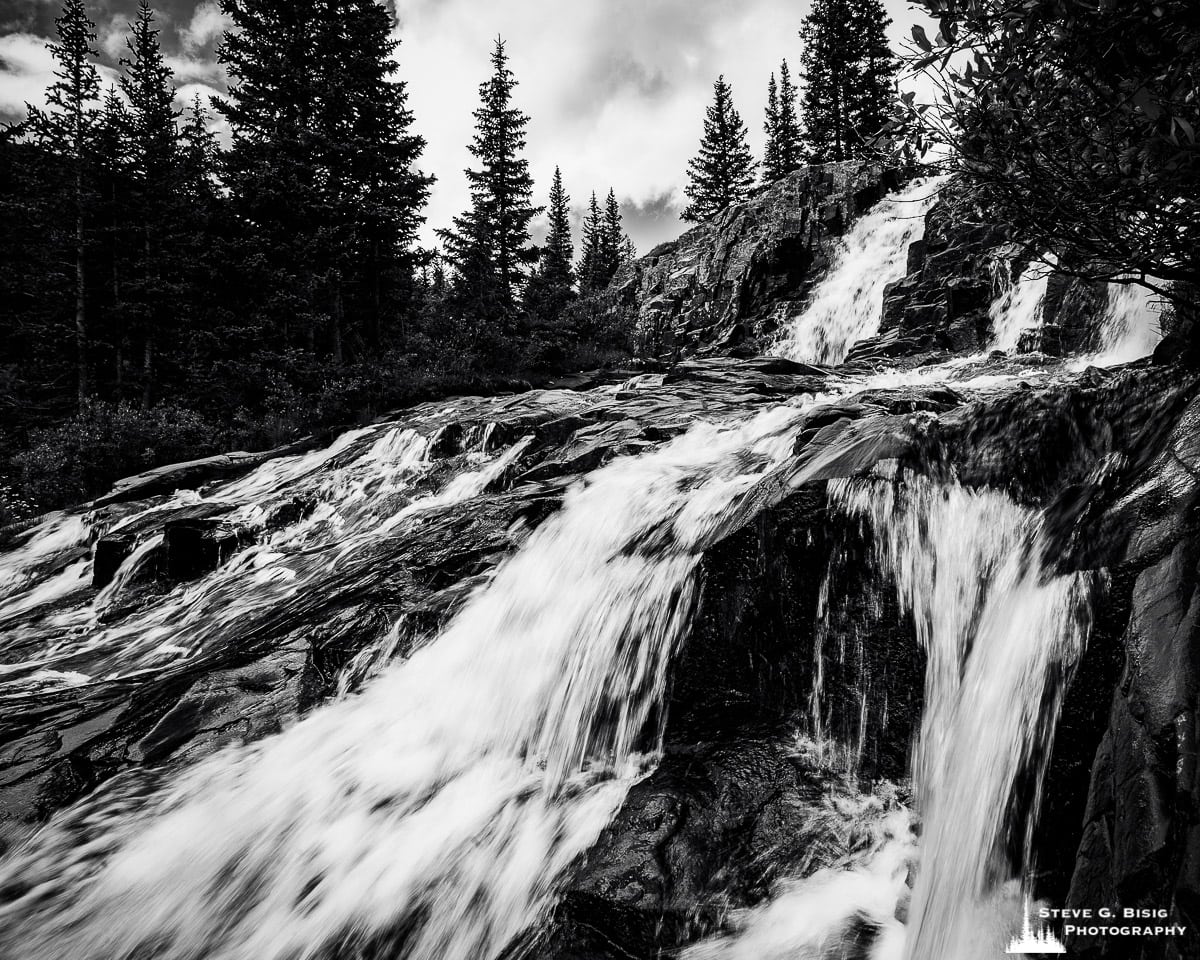 A black and white landscape of photograph of Twin Falls along Sneffel Creek (elevation 11,168 feet) as viewed from the Yankee Boy Basin Road, Ouray County, Colorado.