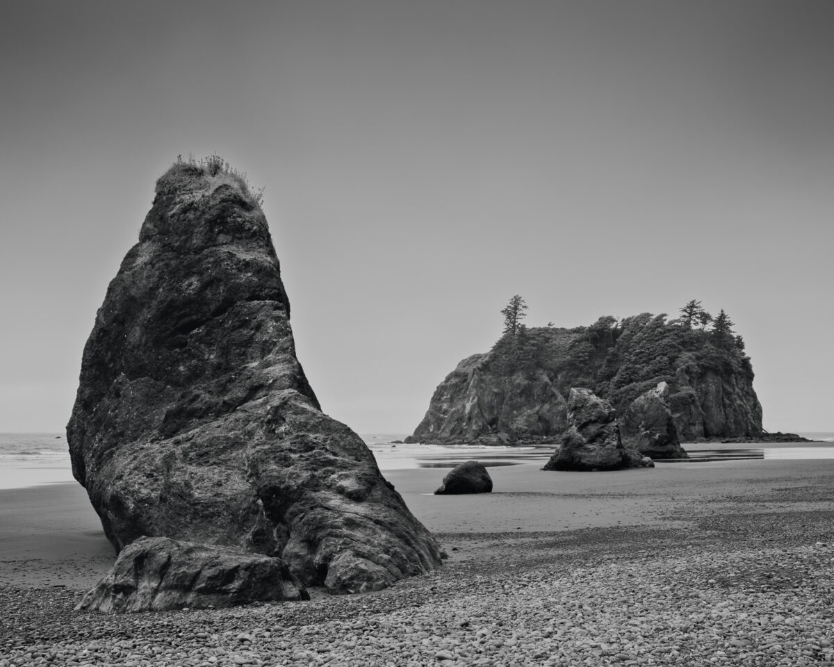 A black and white landscape photograph of seal rock at Ruby Beach in the Olympic National Park, Washington.