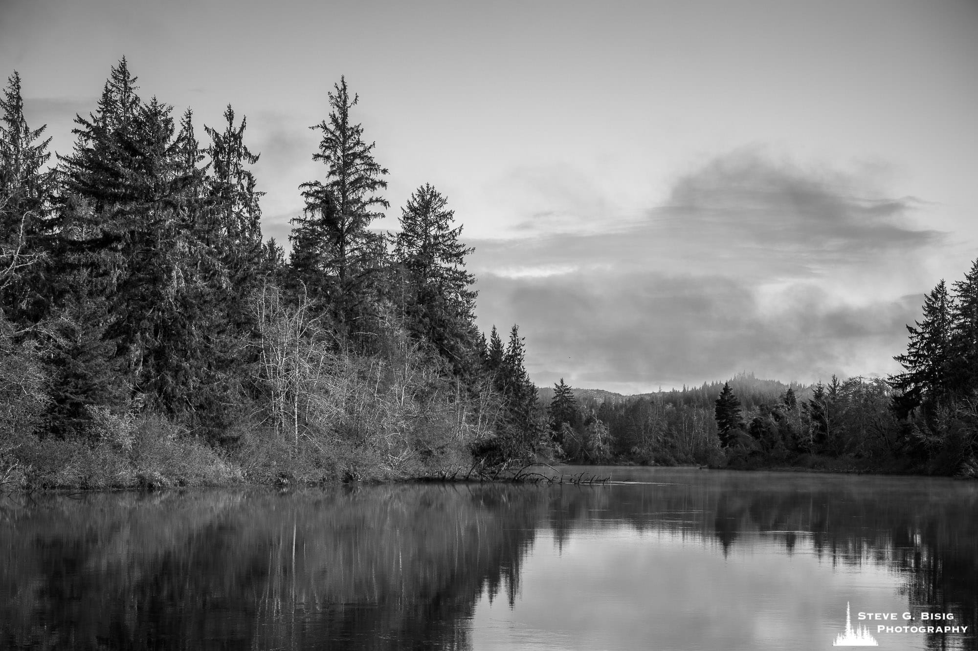 A black and white landscape photograph of the Grays River in Southwest Washington.