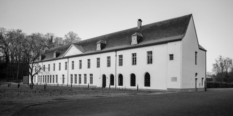 A black and white photograph of the Prior's House from the Abbaye du Rouge Cloître in Brussels, Belgium.