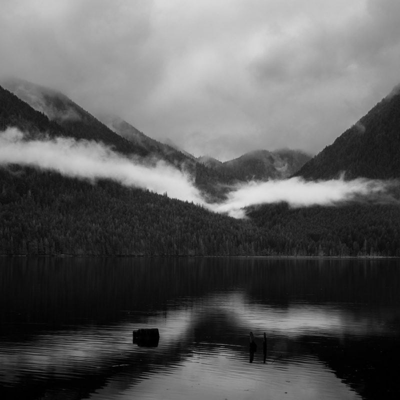 A black and white landscape photograph overlooking Lake Cushman, Washington, towards the Dry Creek Valley on an early spring afternoon.