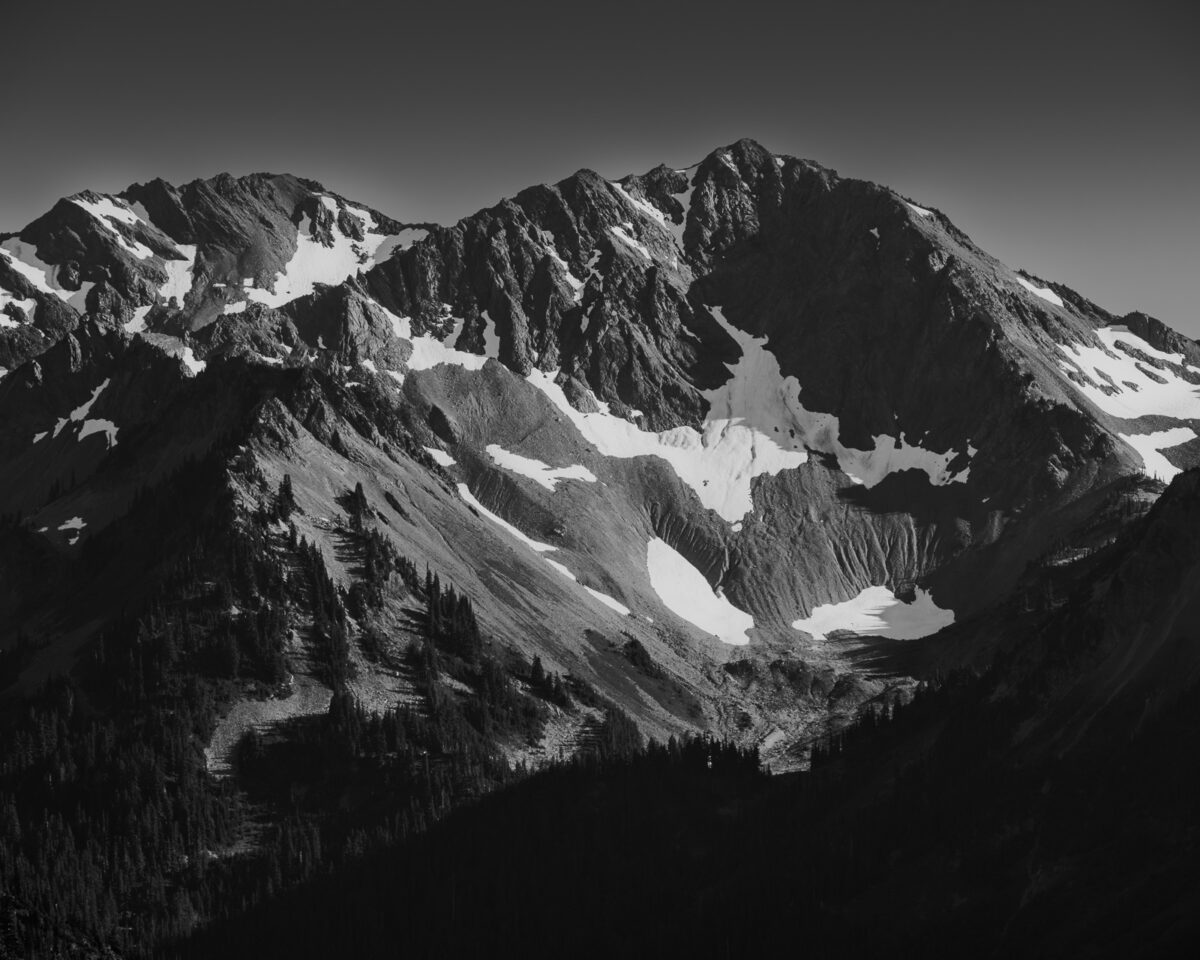 A black and white landscape photograph of McCartney Peak (6,784-foot-elevation) in the Olympic National Park, Washington.