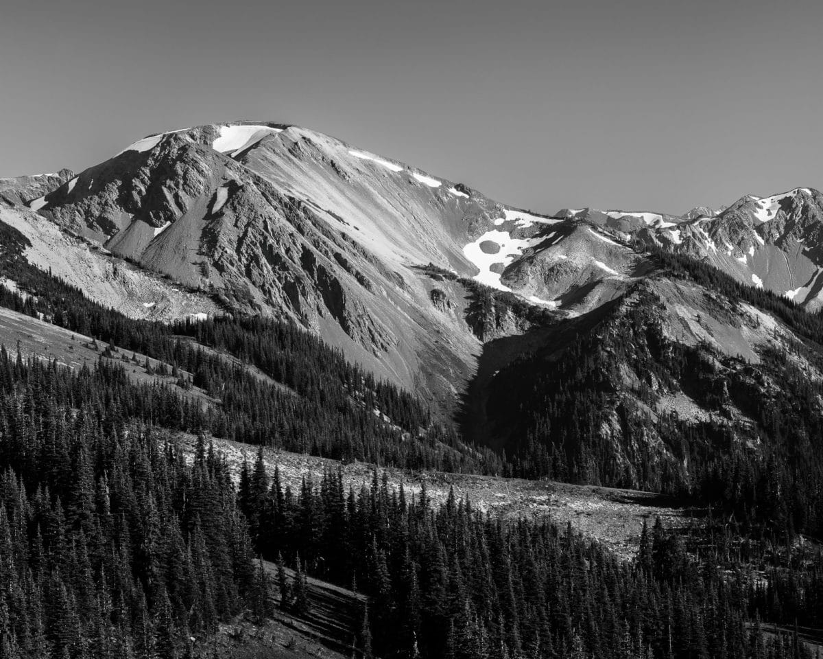 A black and white landscape photograph of Moose Peak (6760-foot-elevation) in the Olympic National Park, Washington.