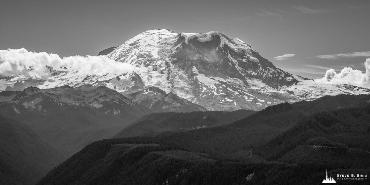 A black and white landscape photograph of Mt. Rainier as viewed from Sun Top near Greenwater, Washington.