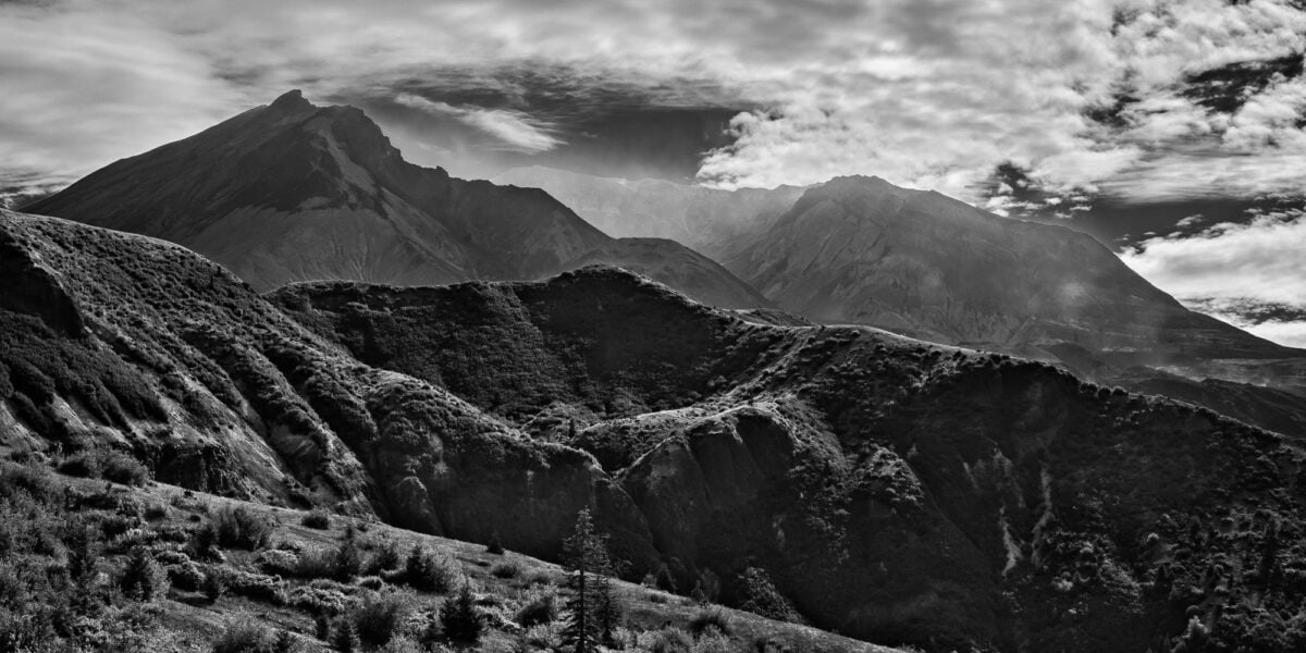 A black and white panoramic landscape photograph of Mt. St. Helens from Windy Ridge in Skamania County, Washington.