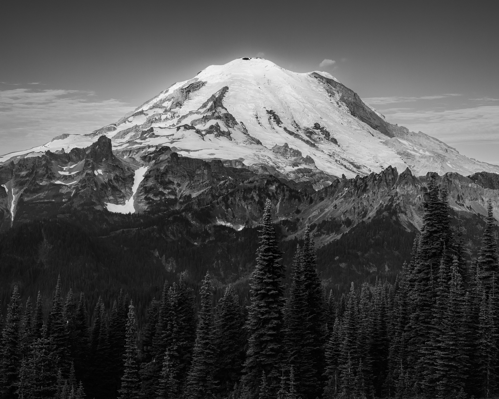 A black and white landscape photograph of Mt. Rainier as viewed along the Naches Peak Loop trail near Chinook Pass, Washington.