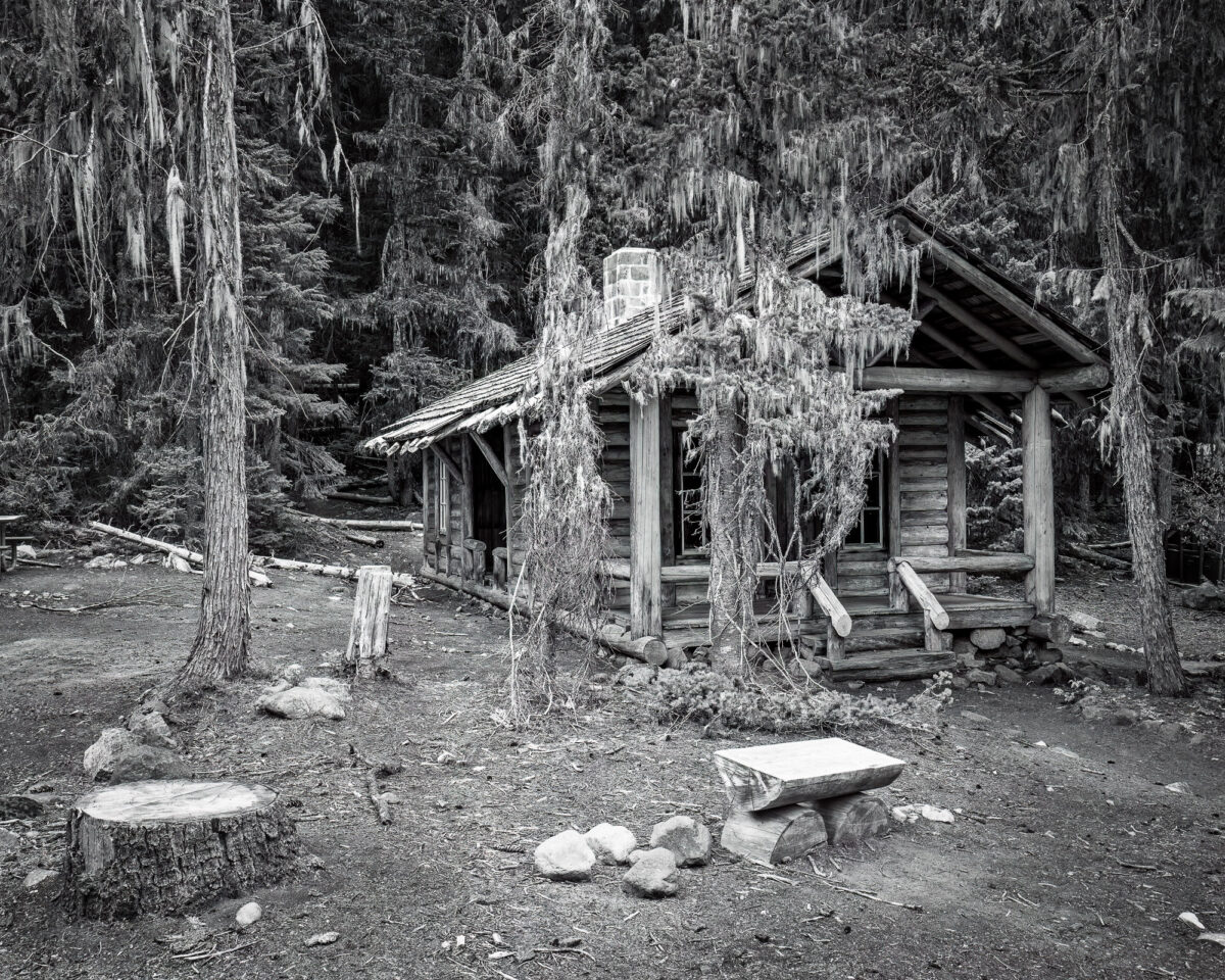 A black and white photograph of the White River Patrol Cabin in Mt. Rainier National Park, Wsshington, The historic cabin was built in the late 1920s and is part of a series of patrol cabins linked by trails that helped the early rangers protect the park.