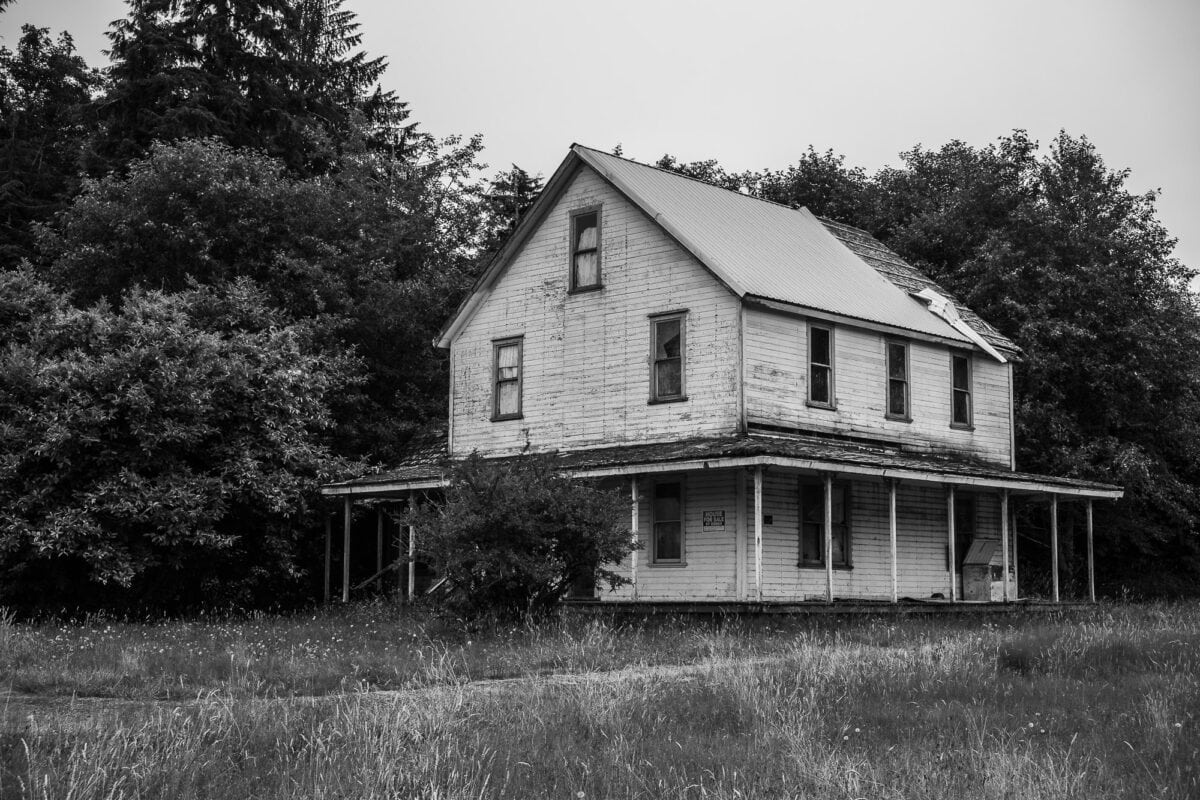 A black and white photograph of an old farmhouse in Nemah, Washington.