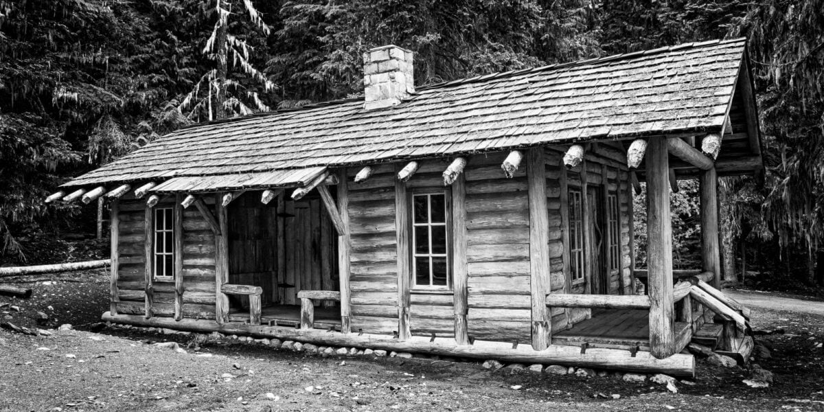 A black and white photograph of the White River Patrol Cabin in Mt. Rainier National Park, Washington, The historic cabin was built in the late 1920s and is part of a series of patrol cabins linked by trails that helped the early rangers protect the park.