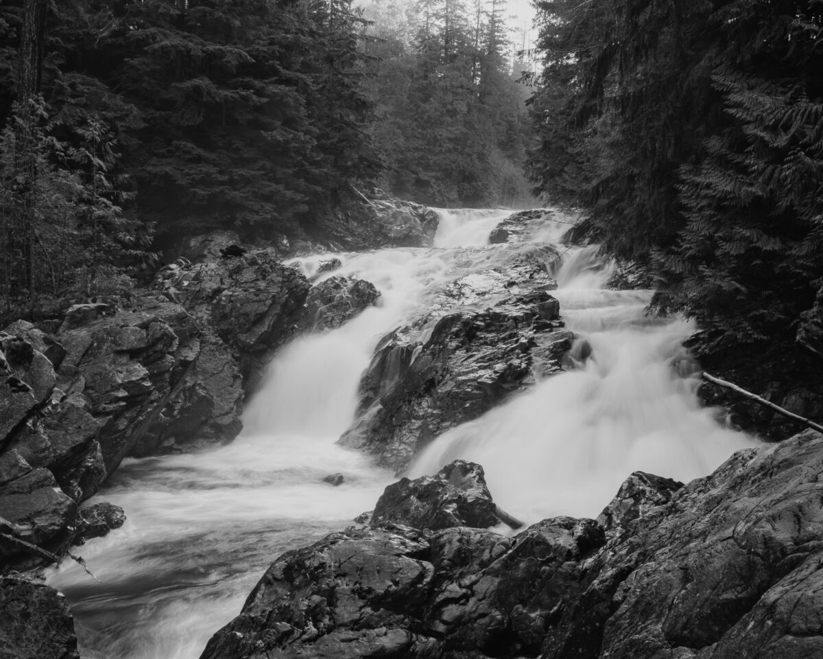 A black and white photograph of Weeks Falls on the South Fork of the Snoqualmie River at Olallie State Park, Washington.