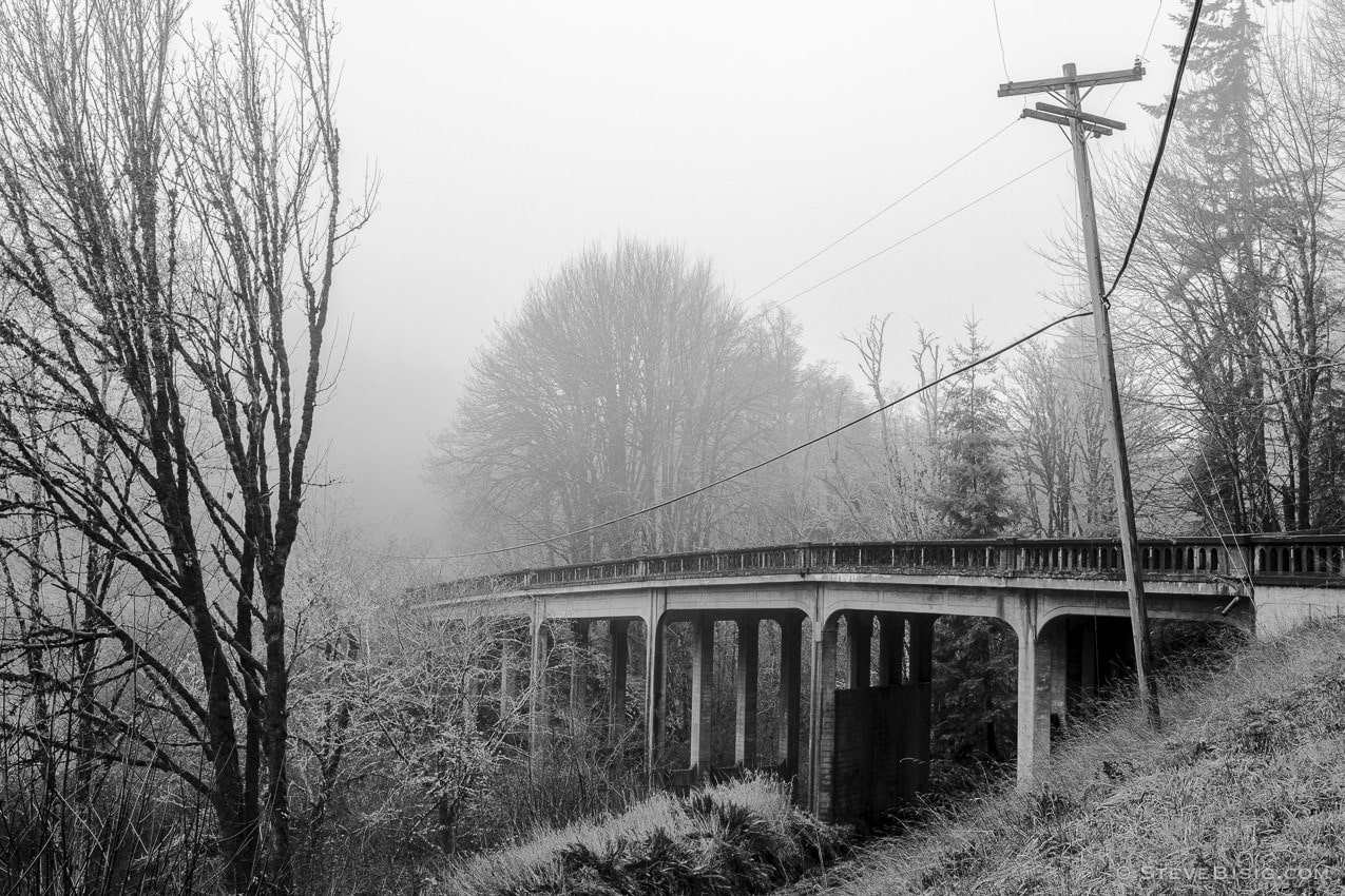 A black and white photograph of an old bridge on State Route 6 crossing a ravine near the Lewis County town of Pe Ell, Washington.