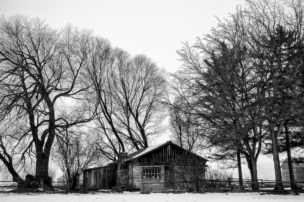 A black and white photograph of the old Olmstead homestead on a foggy winter day at the Olmstead Place State Park in Kittitas County near Kittitas, Washington.