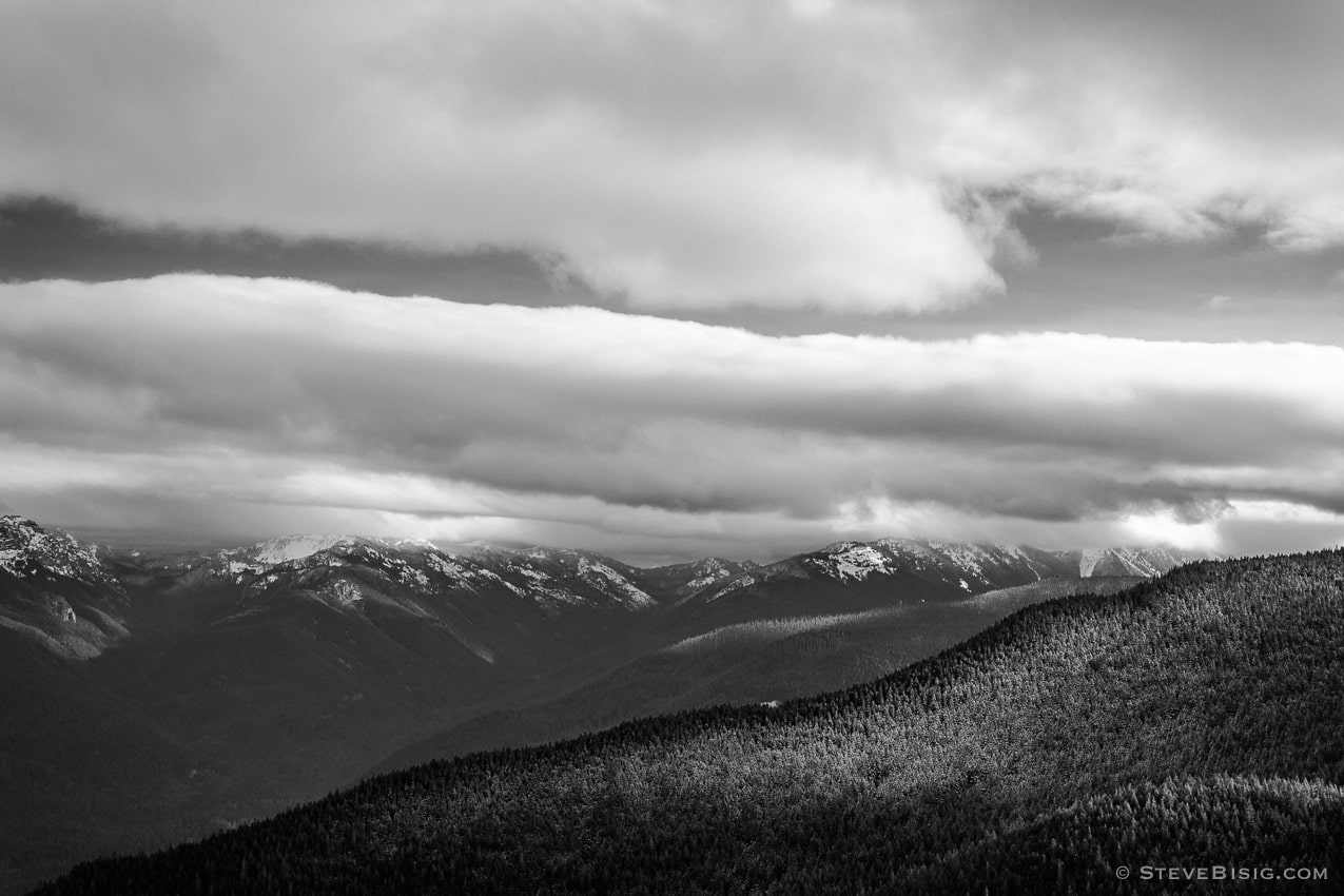 A black and white photograph looking towards the  Washington Cascades on a cloudy late Autumn day as seen from the Sun Top Lookout near Mount Rainier National Park, Washington.