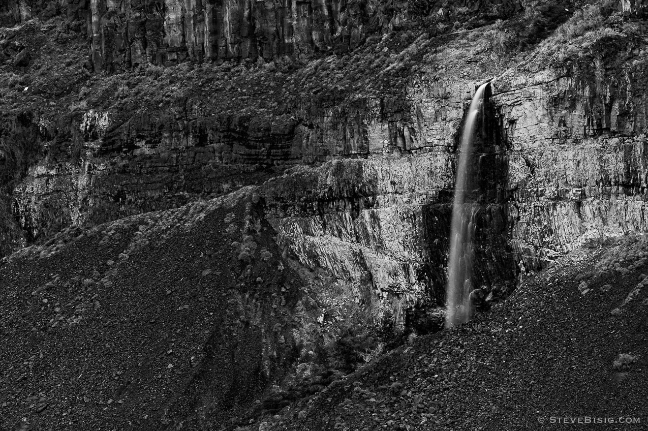 A black and white fine art landscape photograph of a Stolp Falls in the Frenchman Coulee near Vantage, Washington.